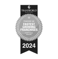 A badge displaying "Transworld Business Advisors" with a silver laurel wreath and text "Franchise 500 Fastest Growing Franchises 2024" by Entrepreneur Magazine.